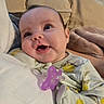 Ainsley joined the competition — help win amazing prizes! baby, blanket, child, closeup, clothing, comfort, couch, eyelashes, face, furniture, happy, head, indoors, infant, pacifier, patterned_clothing, person, skin, smile, soft