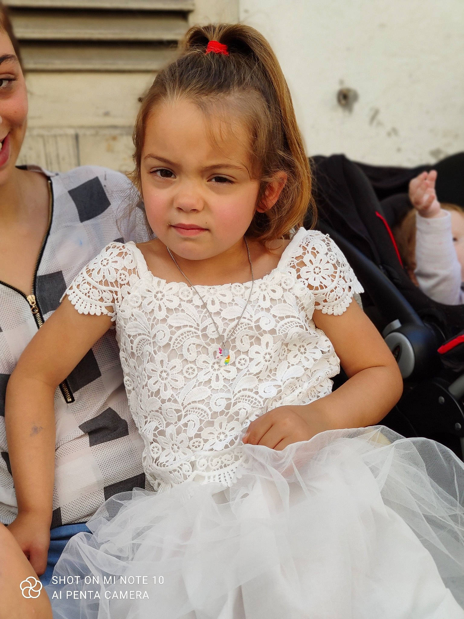 Vayanna participe au concours pour gagner de l'argent avec cette photo : bridal_accessory, bridal_clothing, dress, event, fashion_design, formal_wear, fun, gesture, gown, hair, hairstyle, happy, iris, person, pink, shoulder, skin, smile, textile, toddler