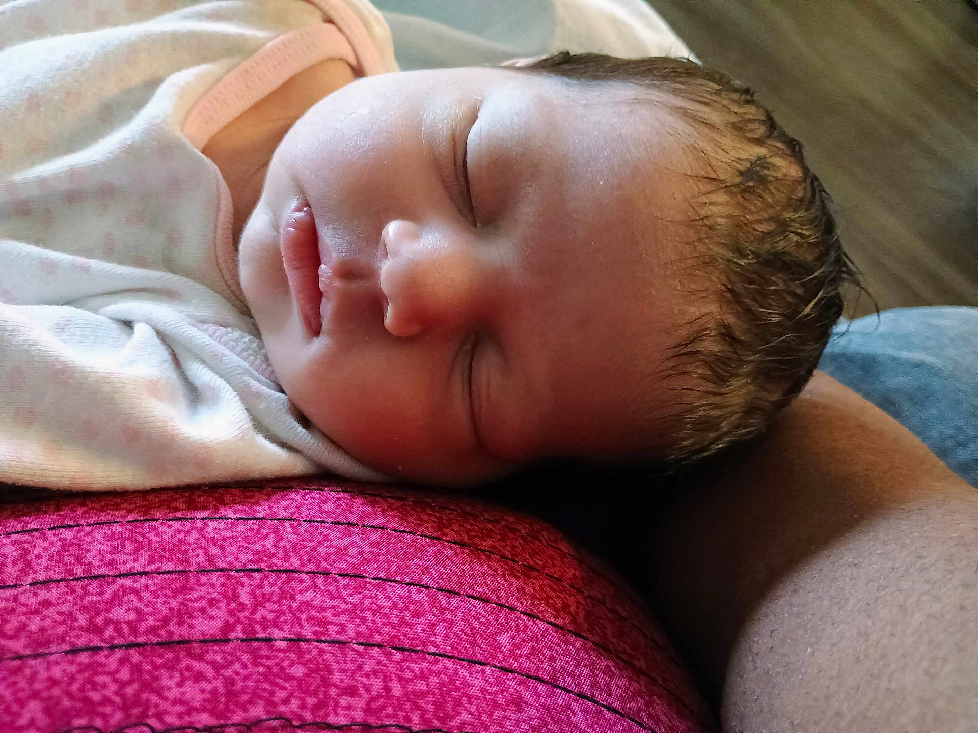 Royalty is registered to the contest to win money with this photo: baby, newborn, sleeping, face, head, skin, hair, person, arm, clothing, texture, closeup, peaceful, rest, infant, portrait, soft_light, indoors, cuddle, pink
