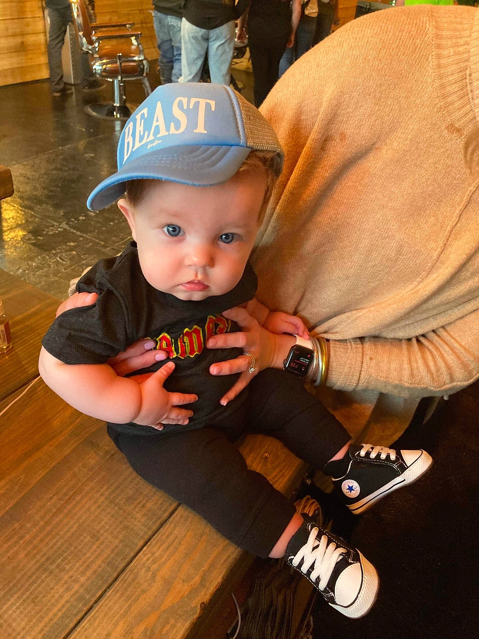 River joined the competition — help win amazing prizes! baby_toddler_clothing, baseball_cap, cap, chair, child, event, fashion_accessory, flooring, fun, happy, hardwood, hat, headwear, orange, person, personal_protective_equipment, sitting, t_shirt, toddler, varnish