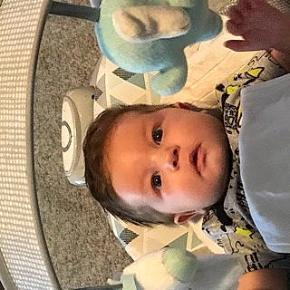 River is registered to the contest to win money with this photo: baby, chair, cheek, child, chin, ear, eyebrow, eyelash, forehead, happy, head, iris, lip, mouth, nose, person, skin, smile, textile, toddler