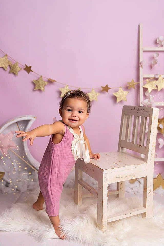 Calie participe au concours pour gagner de l'argent avec cette photo : baby_toddler_clothing, chair, child, dress, event, fashion_design, floor, flooring, formal_wear, fun, happy, hardwood, joy, leg, magenta, person, pink, purple, skin, smile
