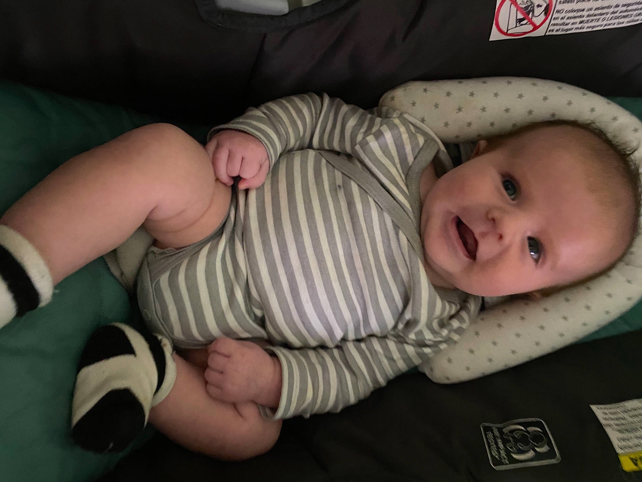 Brexton is registered to the contest to win money with this photo: baby, baby_products, baby_safety, baby_toddler_clothing, cheek, child, comfort, elbow, gesture, human_leg, knee, linens, pattern, person, sitting, skin, sleeve, smile, thigh, thumb