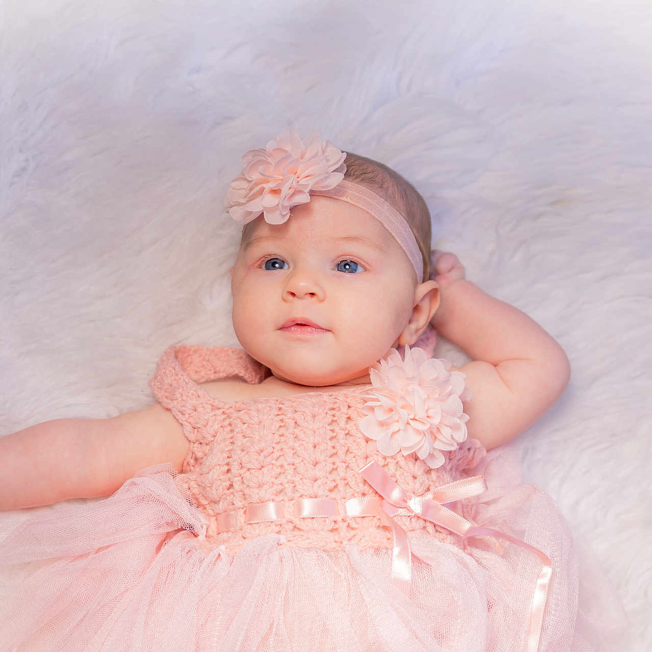 Evelyn joined the competition — help win amazing prizes! baby, bodypart, bonnet, clothing, dress, face, finger, formalwear, furniture, hand, happy, hat, head, newborn, person, photography, portrait, sitting, smile, toy