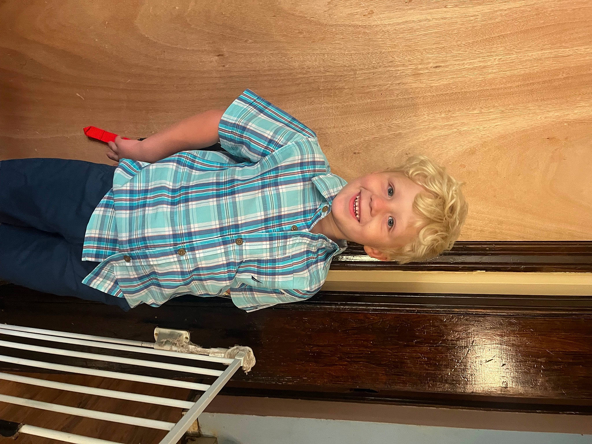 Francis joined the competition — help win amazing prizes! child, comfort, flooring, fun, hardwood, human_leg, joy, leisure, line, outdoor_bench, pattern, person, plaid, room, sitting, smile, t_shirt, tartan, tints_and_shades, toddler