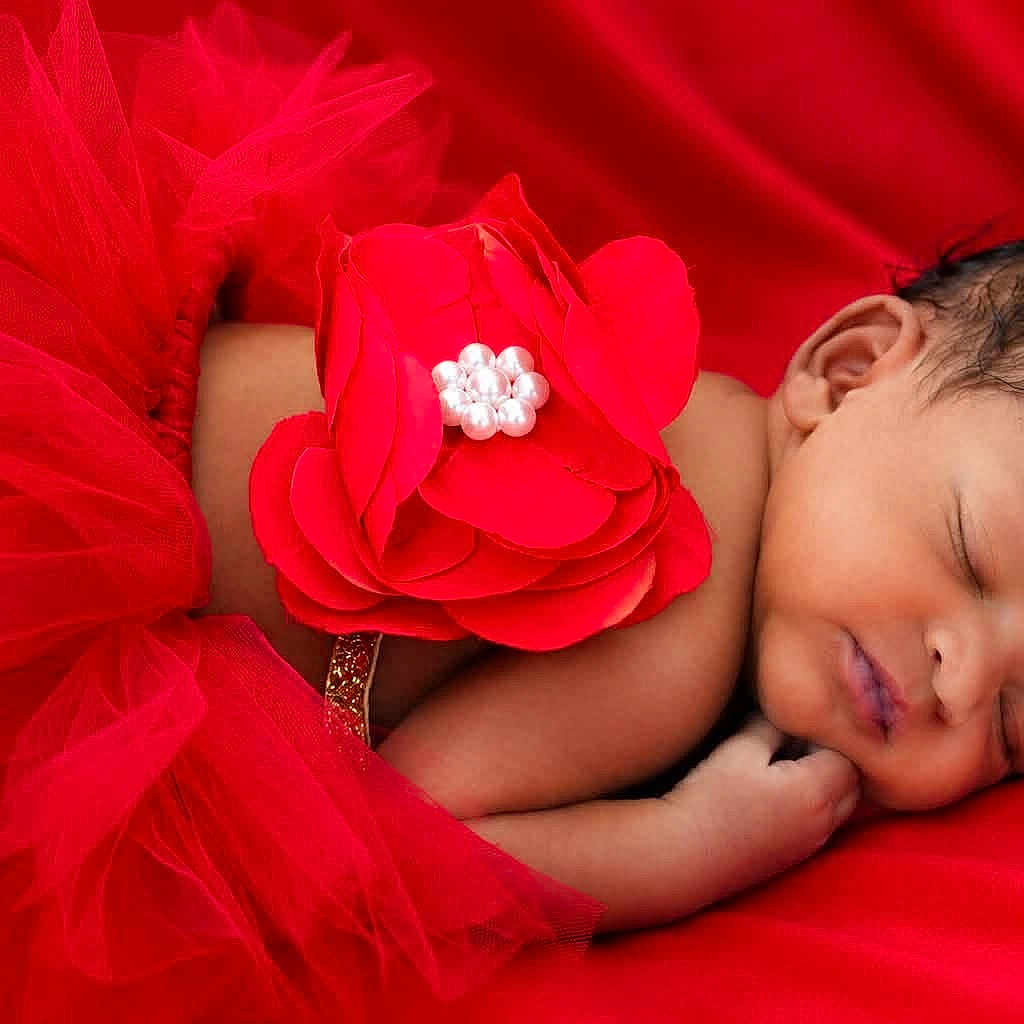 Cortlynn is registered to the contest to win money with this photo: baby, newborn, sleeping, red_tutu, flower, tulle, infant, cute, face, skin, peaceful, resting, portrait, closeup, child, soft, fabric, colorful, adorable, young