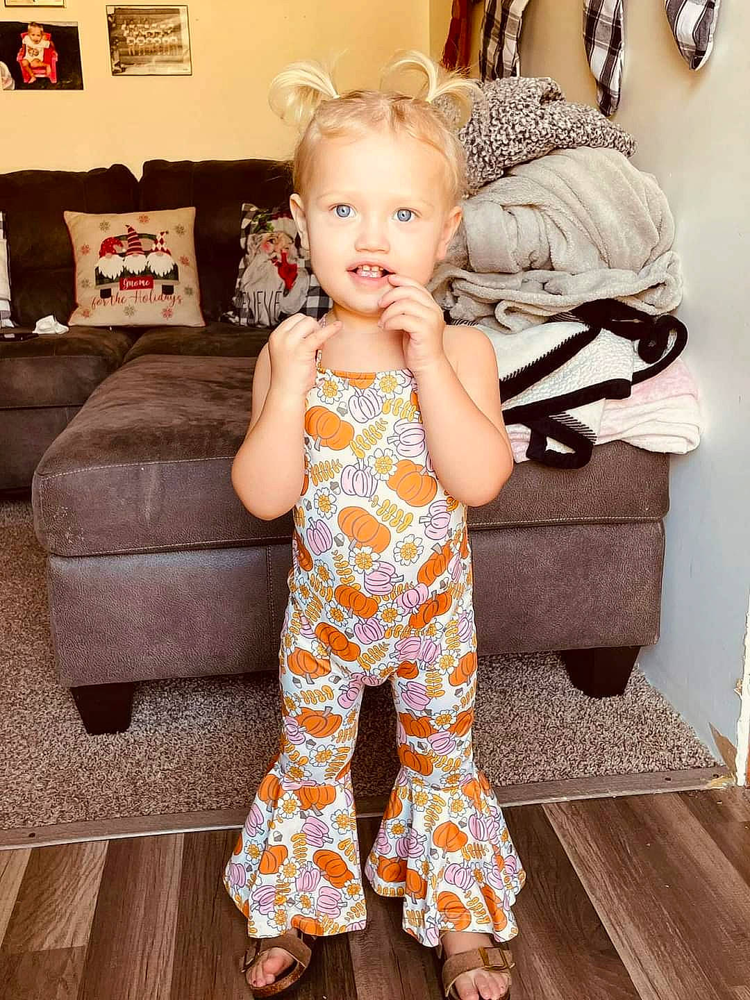 Haylee James Hubbard joined the competition — help win amazing prizes! active_pants, baby, baby_toddler_clothing, comfort, couch, eye, floor, flooring, foot, happy, human_leg, living_room, pattern, person, sitting, sleeve, smile, sportswear, t_shirt, thigh
