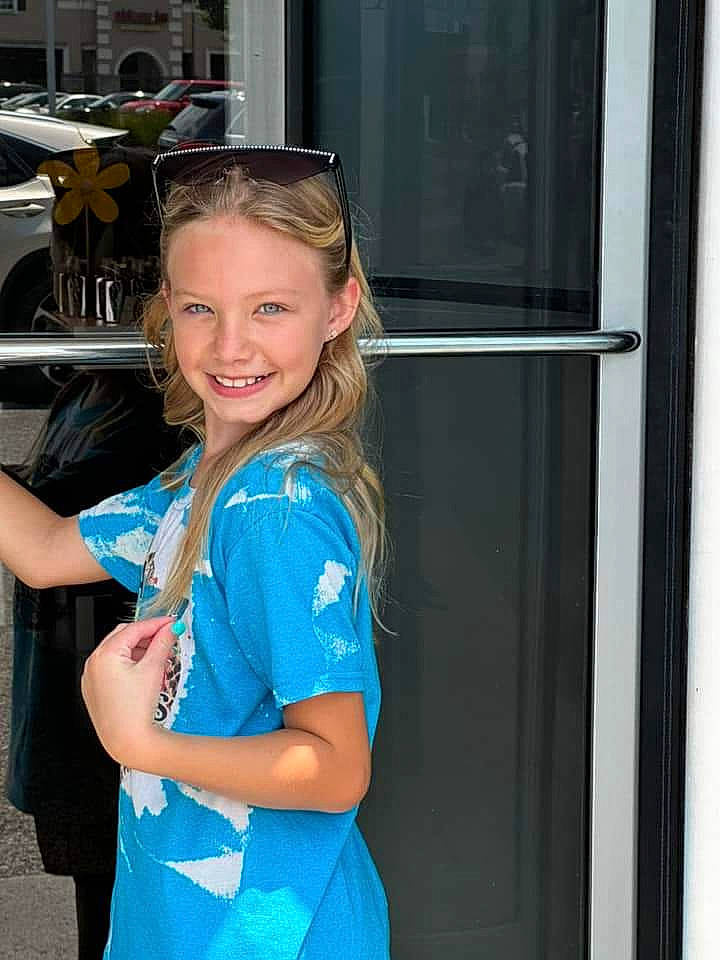 Averee Renee Garland is registered to the contest to win money with this photo: automotive_design, automotive_exterior, brown_hair, electric_blue, eyewear, fashion_design, fun, goggles, happy, human_leg, jewellery, joint, joy, leisure, long_hair, motor_vehicle, person, shoulder, smile, sunglasses