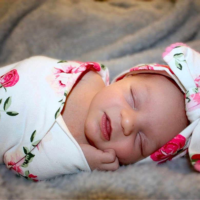 Thea joined the competition — help win amazing prizes! baby, bed, blanket, bonnet, clothing, cushion, face, furniture, glove, happy, hat, head, homedecor, hood, newborn, person, photography, portrait, quilt, sleeping