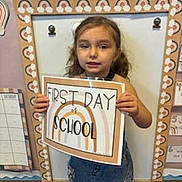Lylah joined the competition — help win amazing prizes! advertisement, architecture, building, child, classroom, face, female, girl, head, indoors, kindergarten, person, photobooth, photography, portrait, poster, room, school, text, whiteboard