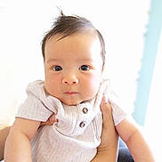 Alfred is registered to the contest to win money with this photo: baby, child, infant, person, face, hands, clothing, cute, portrait, expression, skin, holding, young, looking, indoors, light, soft, casual, closeup, adorable