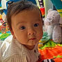 Alfred is registered to the contest to win money with this photo: baby, child, infant, play_mat, toys, plush_elephant, colorful, indoor, curious, closeup, face, eyes, soft_light, crawling, cute, clothing, fabric, background, childhood, portrait