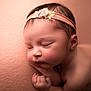 Palmer is registered to the contest to win money with this photo: newborn, baby, sleeping, headband, flower, closeup, soft, peach, blanket, peaceful, infant, skin, portrait, cute, resting, child, tiny, hands, face, delicate