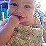 Irie joined the competition — help win amazing prizes! baby, child, smiling, face, hand, indoor, dress, floral_pattern, cute, happy, person, infant, skin, eyes, fingers, seated, young, portrait, playful, closeup