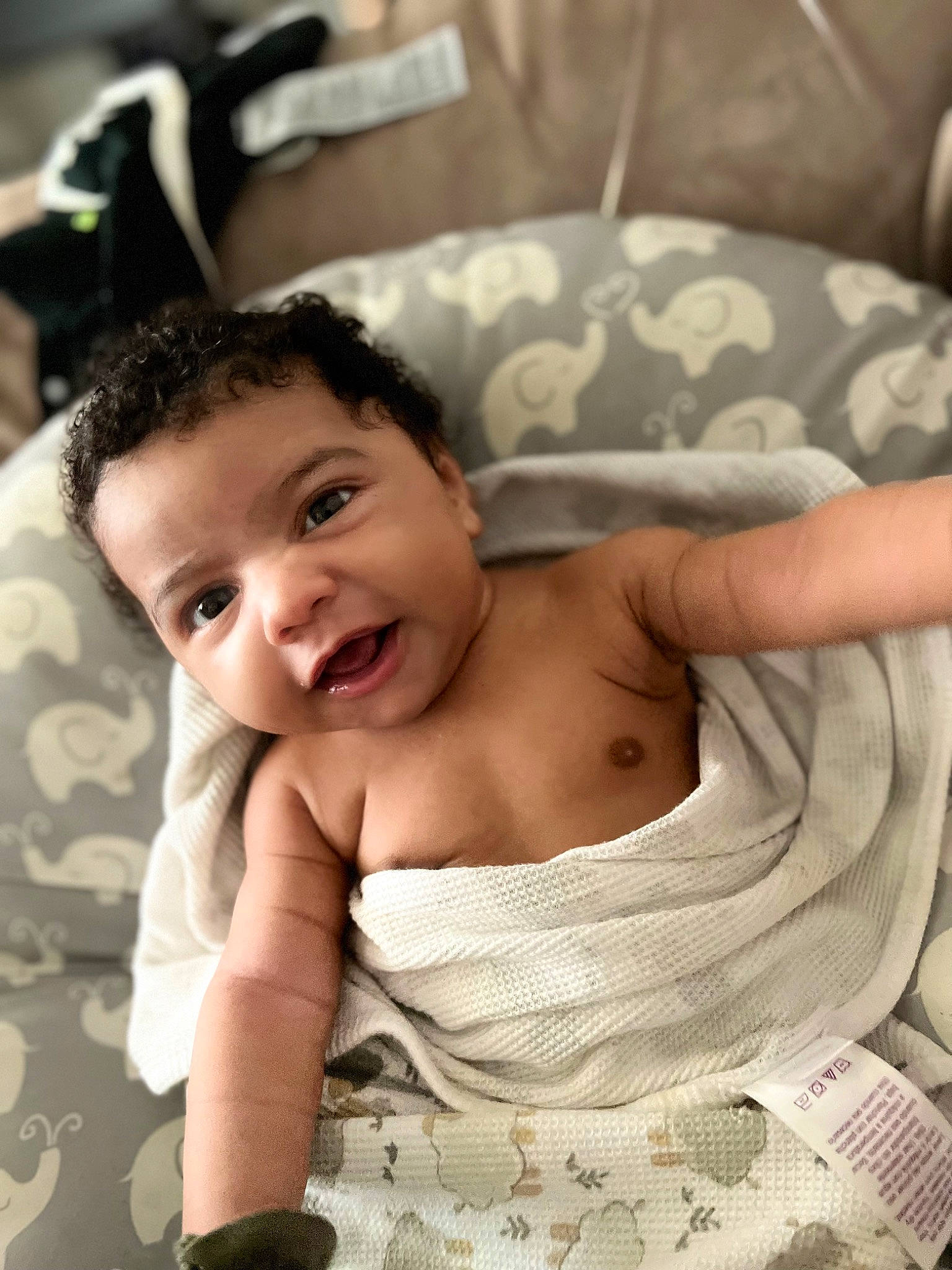 Kayden is registered to the contest to win money with this photo: baby, baby_toddler_clothing, black_hair, chest, chin, comfort, eye, face, finger, flash_photography, gesture, hand, happy, head, mouth, neck, person, skin, smile, toddler