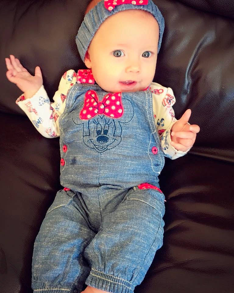 Bridget is registered to the contest to win money with this photo: baby, cheek, child, jeans, person, sitting, skin, toddler