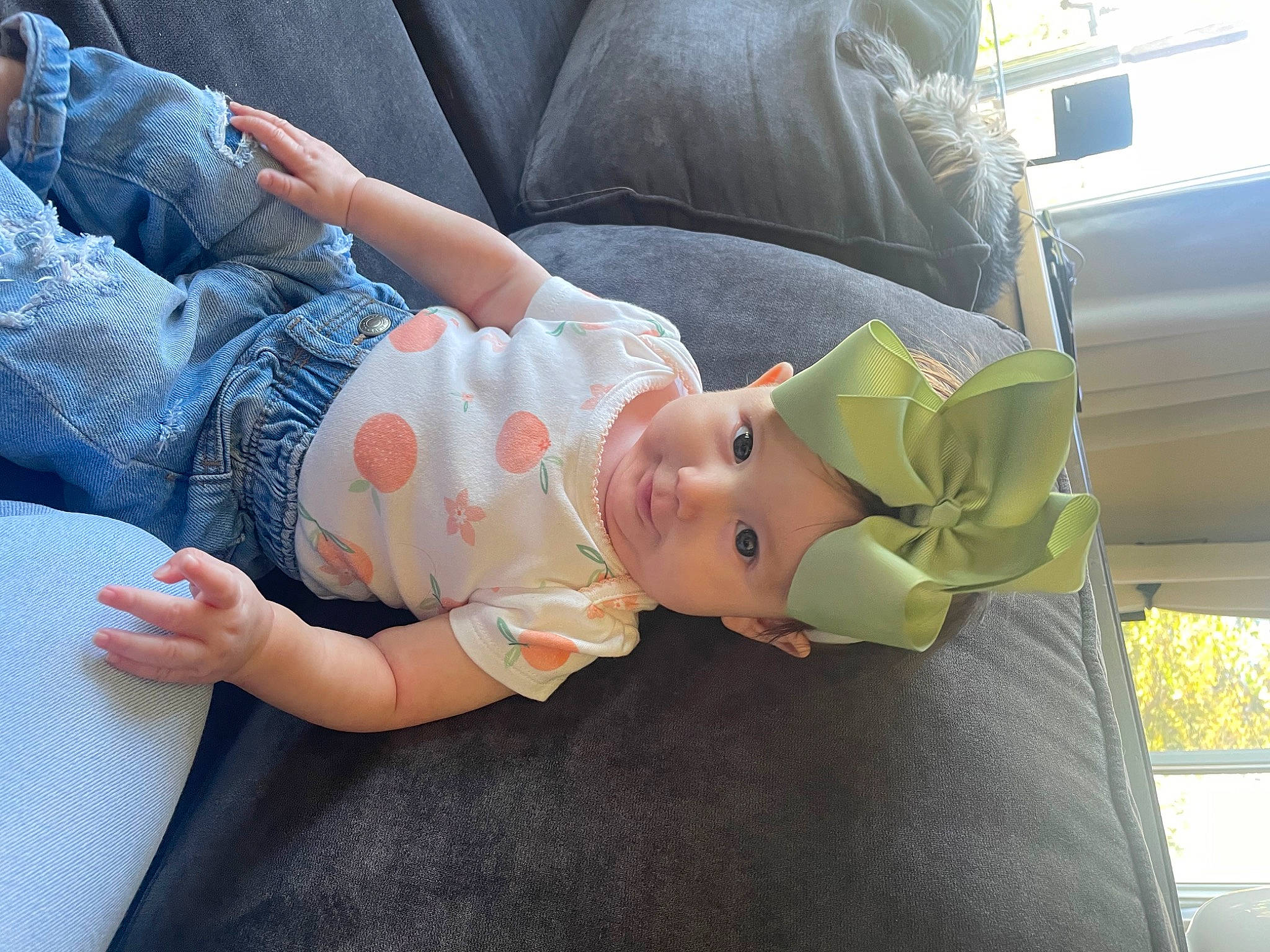 Aryanna is registered to the contest to win money with this photo: auto_part, automotive_exterior, baby, baby_carriage, baby_products, baby_toddler_clothing, car_seat, child, comfort, family_car, grass, headwear, human_leg, lap, linens, motor_vehicle, nap, person, sitting, toddler