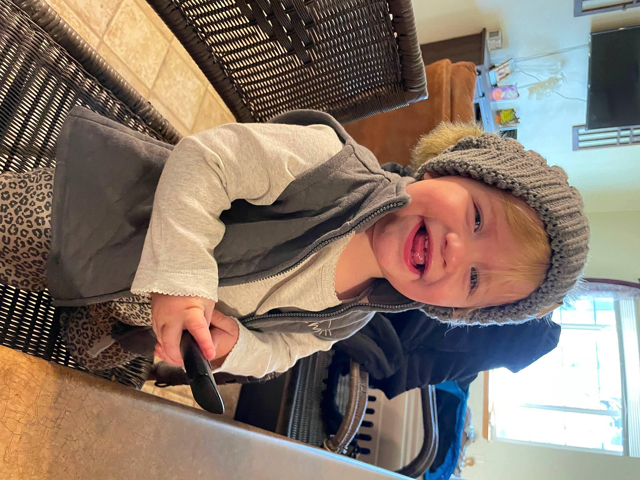 Kennedi joined the competition — help win amazing prizes! cap, child, comfort, fun, happy, hat, headwear, home_appliance, hoodie, joy, laugh, mesh, person, room, sitting, smile, television, toddler, window, winter