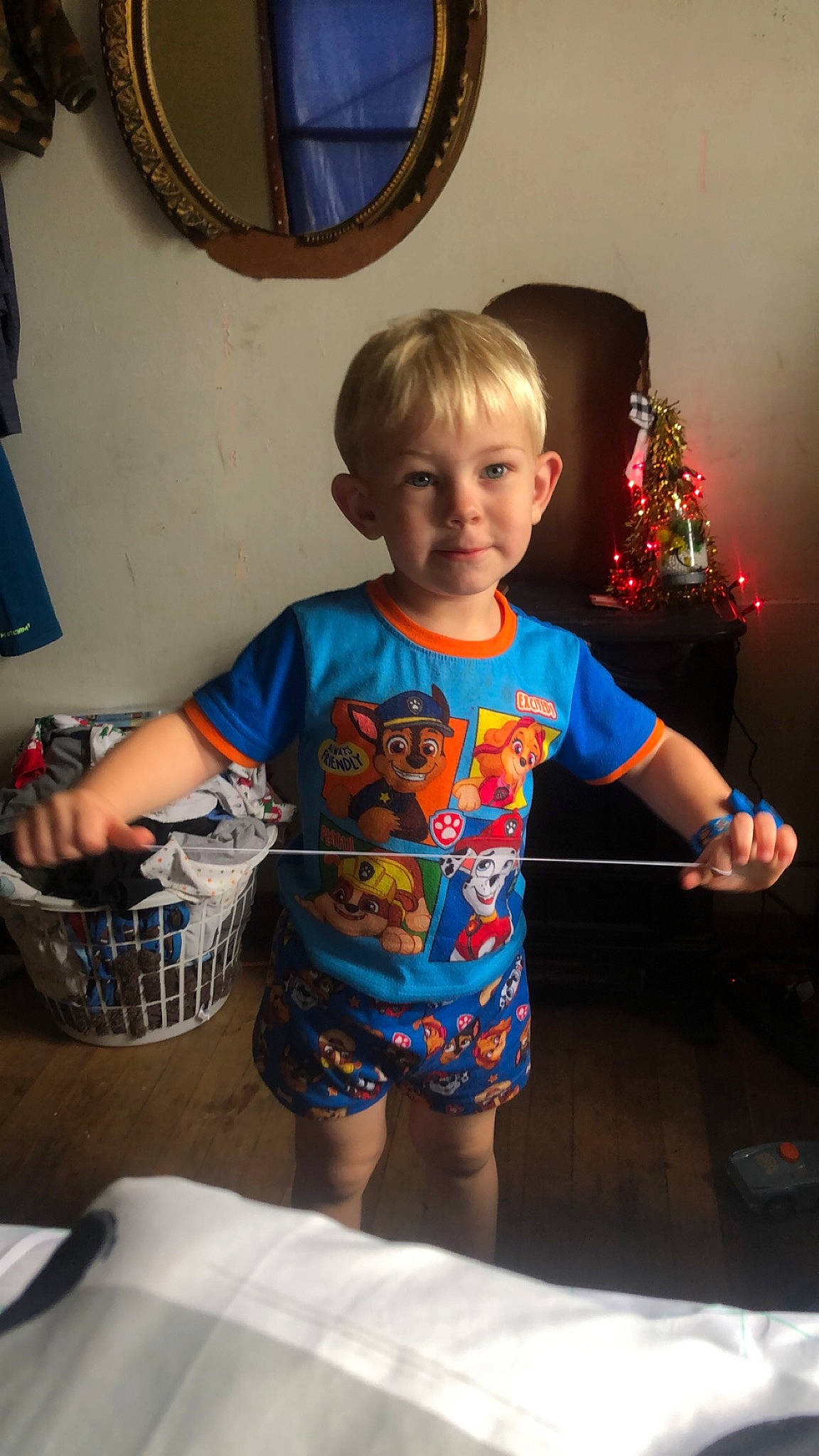 Brentley is registered to the contest to win money with this photo: baby_toddler_clothing, blue, child, christmas_decoration, electric_blue, event, fun, happy, holiday, leisure, mirror, person, picture_frame, play, room, shorts, sitting, sleeve, t_shirt, toddler