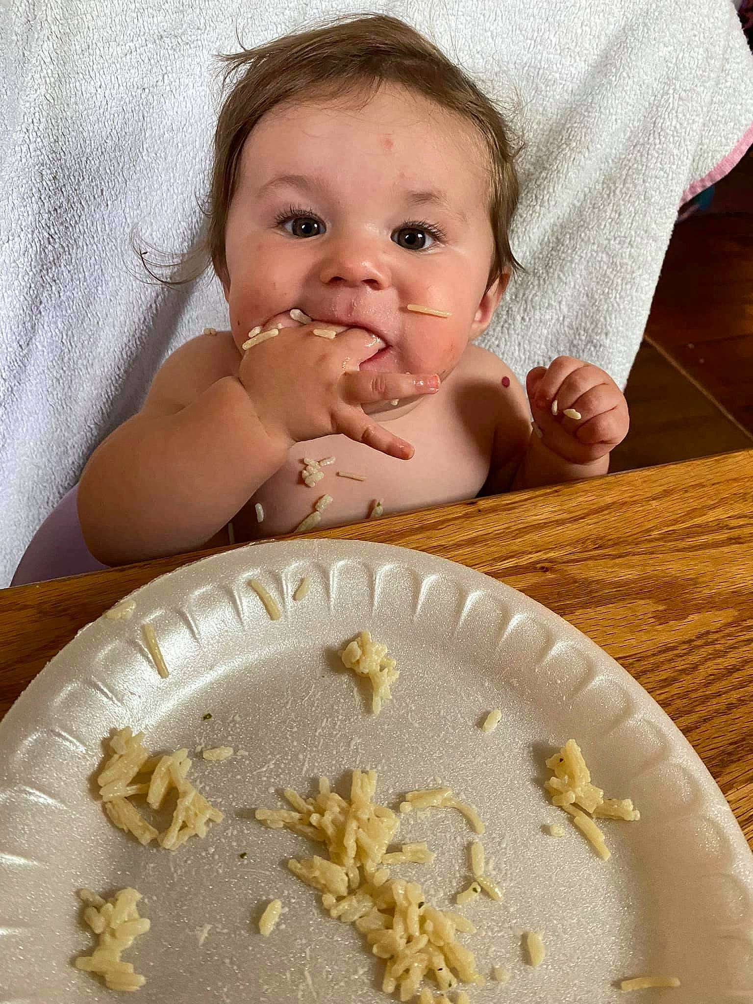 Annalia is registered to the contest to win money with this photo: baby, baby_toddler_clothing, child, cuisine, dish, dishware, drinkware, eye, face, finger, food, gesture, happy, head, ingredient, person, plate, skin, tableware, textile