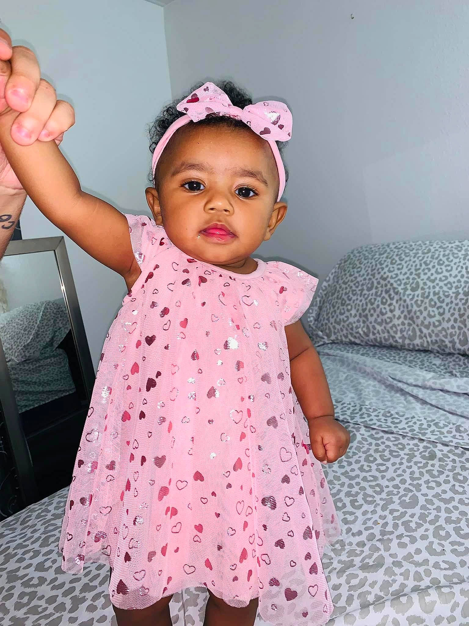 Kyari is registered to the contest to win money with this photo: baby, baby_toddler_clothing, child, clothing, day_dress, dress, eyelash, facial_expression, finger, fun, gesture, happy, magenta, one_piece_garment, pattern, person, pink, skin, sleeve, standing