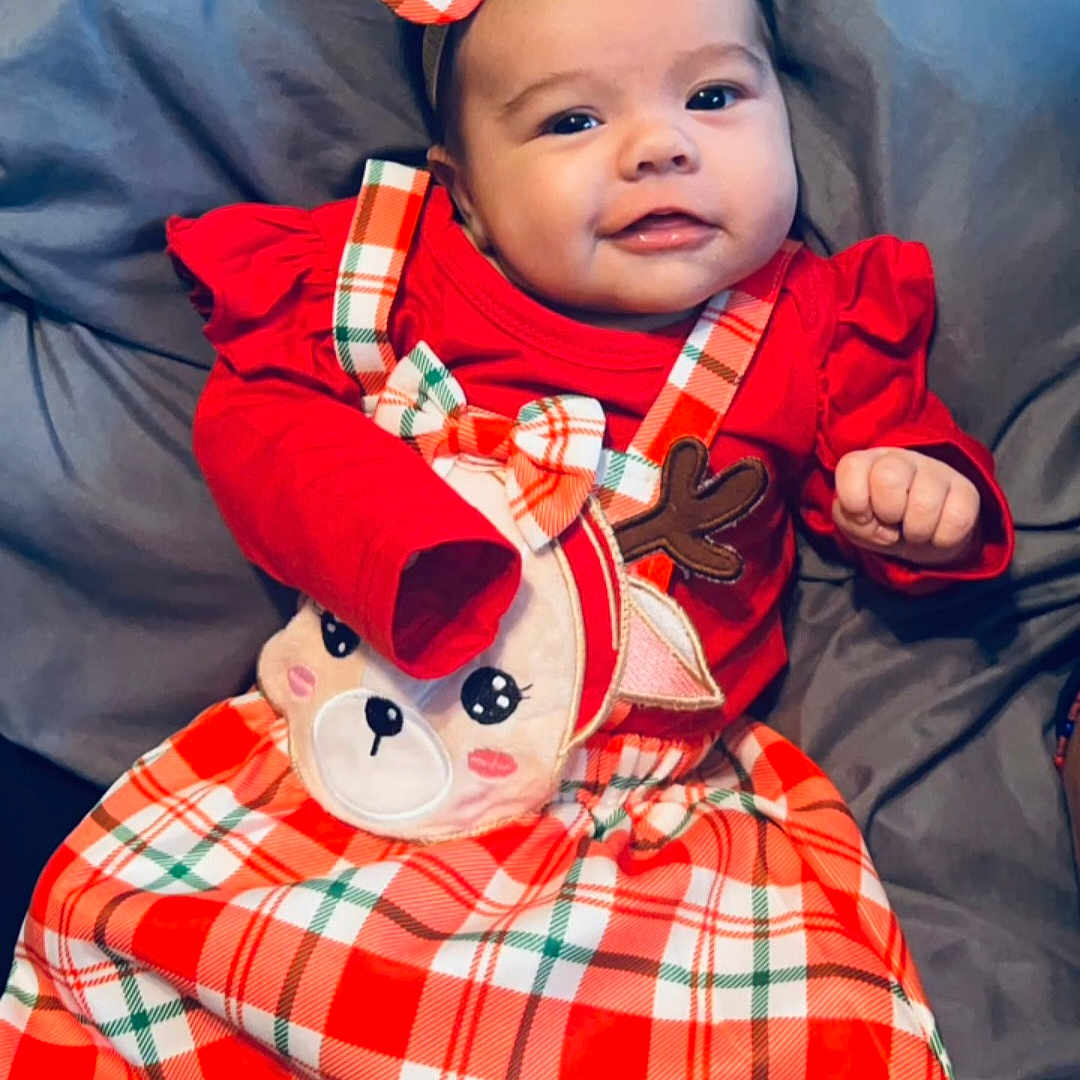Everleigh is registered to the contest to win money with this photo: baby, blanket, clothing, coat, costume, couch, cushion, face, furniture, happy, hat, head, homedecor, jacket, newborn, person, photography, portrait, quilt, smile