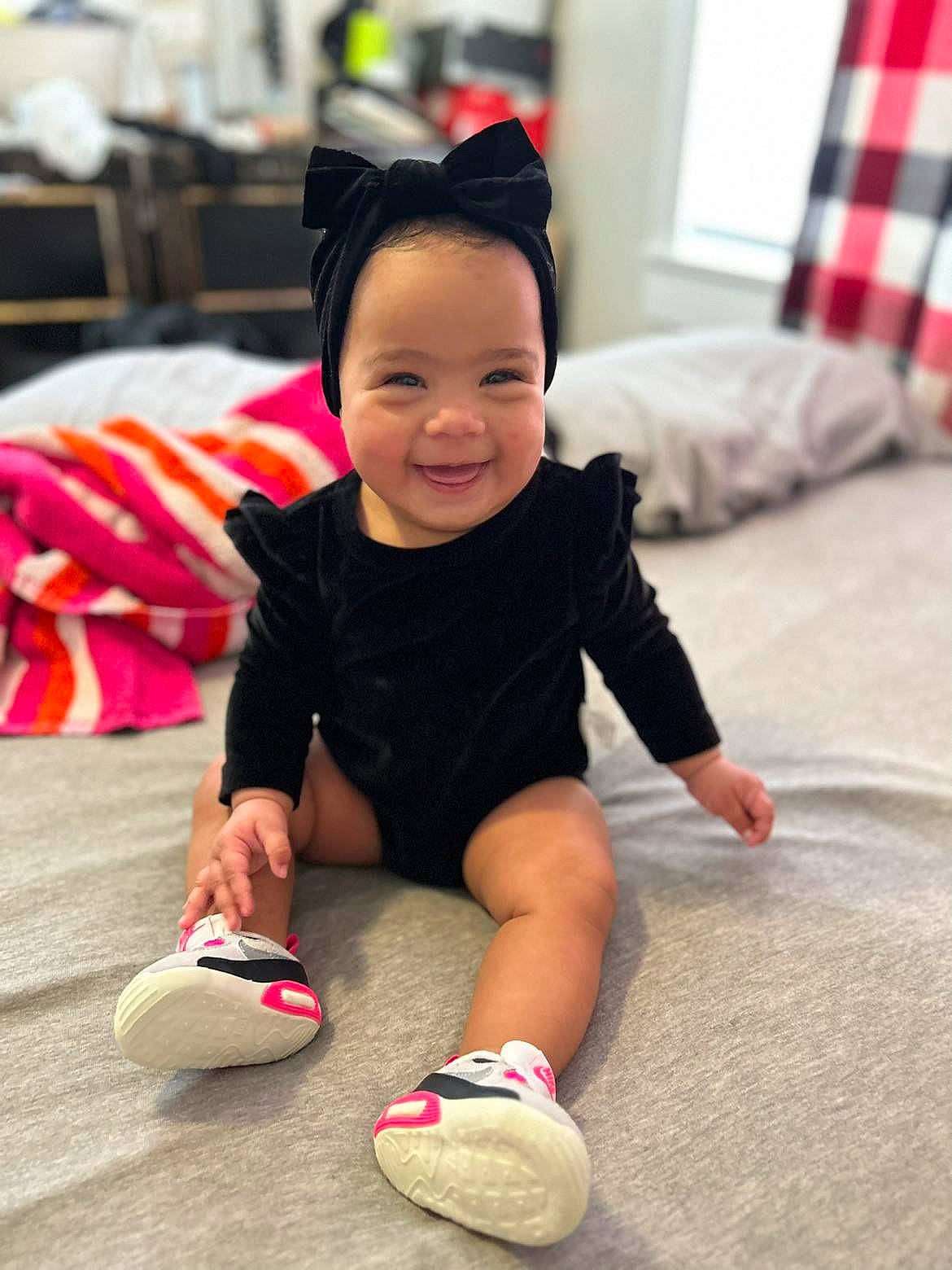 Khelani is registered to the contest to win money with this photo: baby, baby_toddler_clothing, flooring, foot, footwear, fun, happy, hat, human_leg, joy, knee, person, pink, red, shorts, skin, sleeve, smile, sock, textile