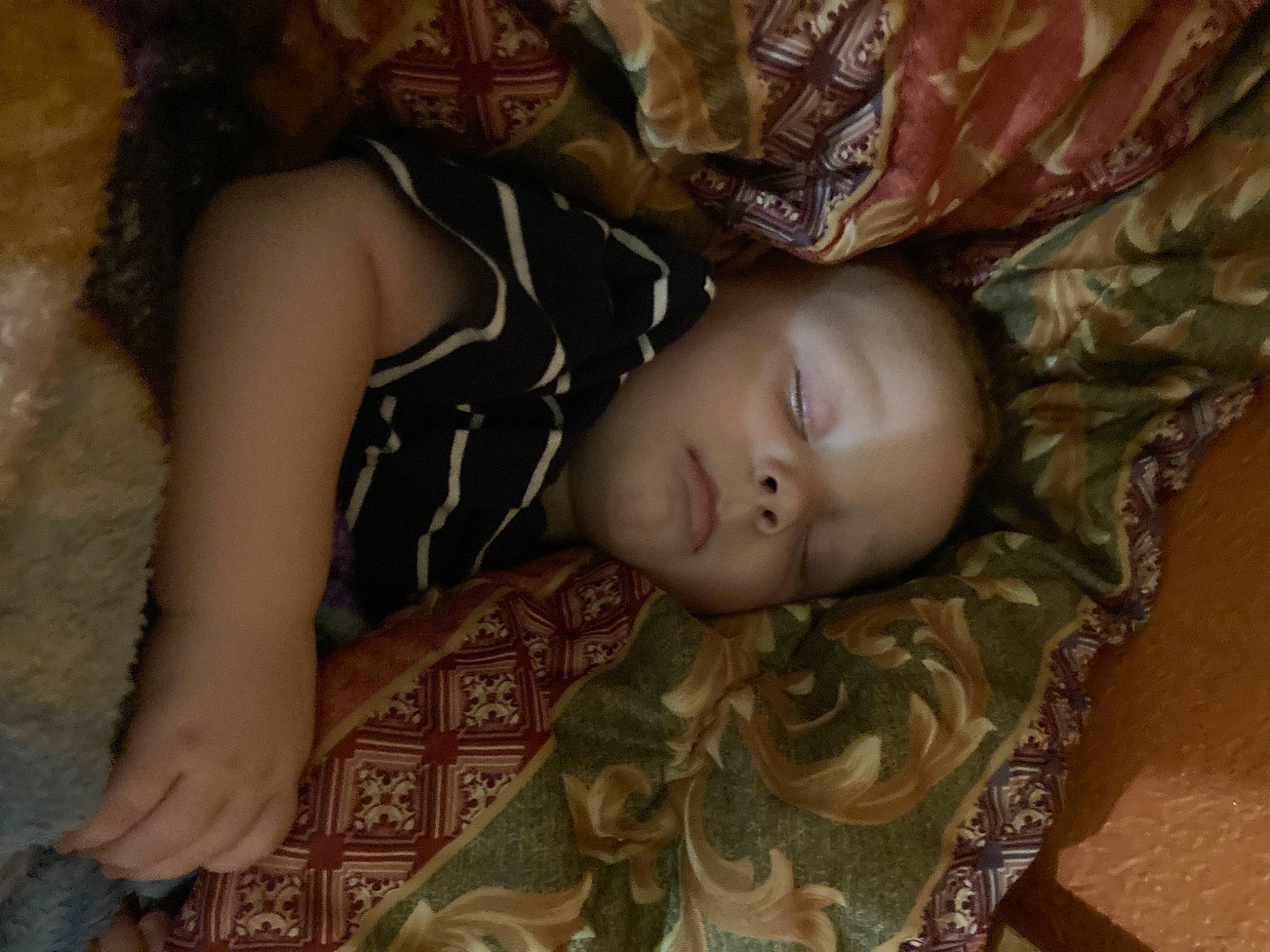 Ashton is registered to the contest to win money with this photo: brown, chest, child, comfort, darkness, eye, flash_photography, flesh, flooring, fun, head, linens, military_camouflage, military_person, non_commissioned_officer, pattern, person, room, tree, trunk