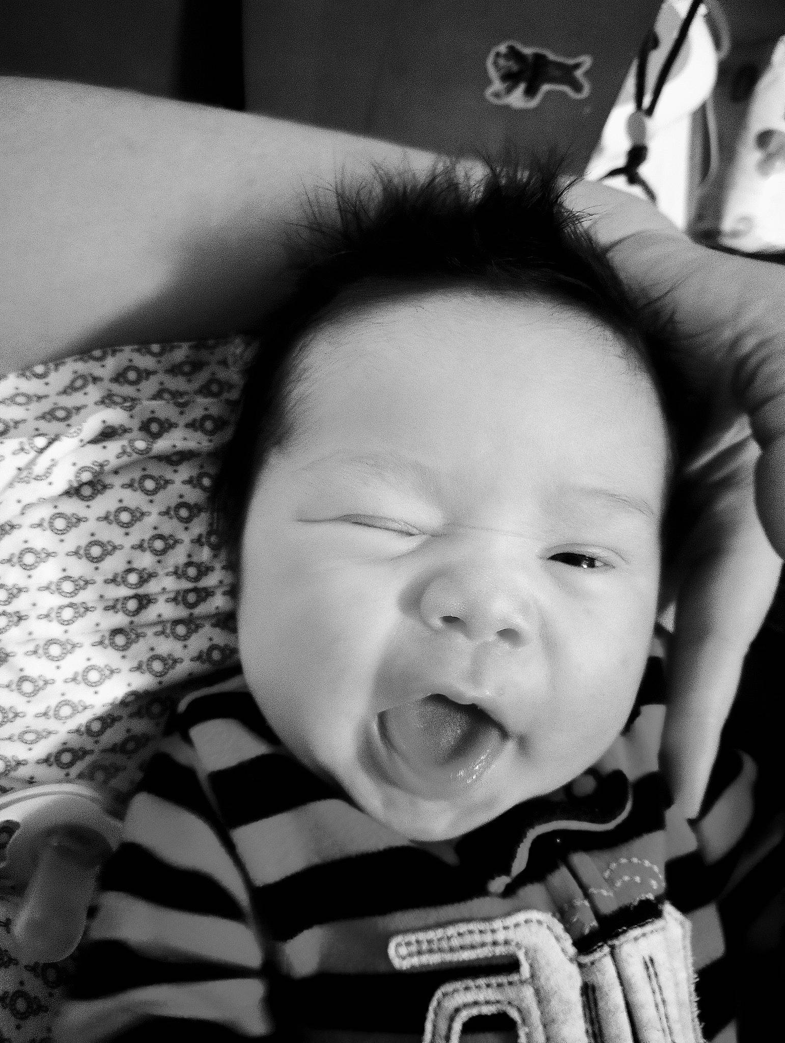 Lazarus is registered to the contest to win money with this photo: baby, black, cheek, chin, ear, eye, eyebrow, eyelash, flash_photography, gesture, happy, iris, lip, mouth, nose, person, photograph, product, skin, standing