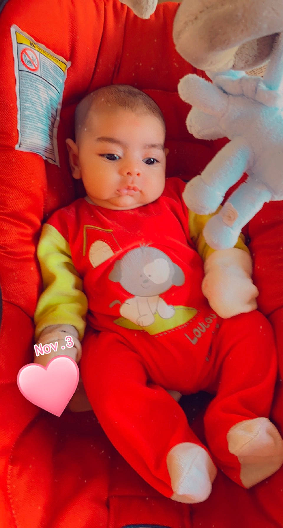 Ahmed participe au concours pour gagner de l'argent avec cette photo : baby, baby_products, baby_toddler_clothing, baby_toys, cheek, child, comfort, finger, nail, overall, person, plush, red, skin, sock, stuffed_toy, thumb, toddler, toy