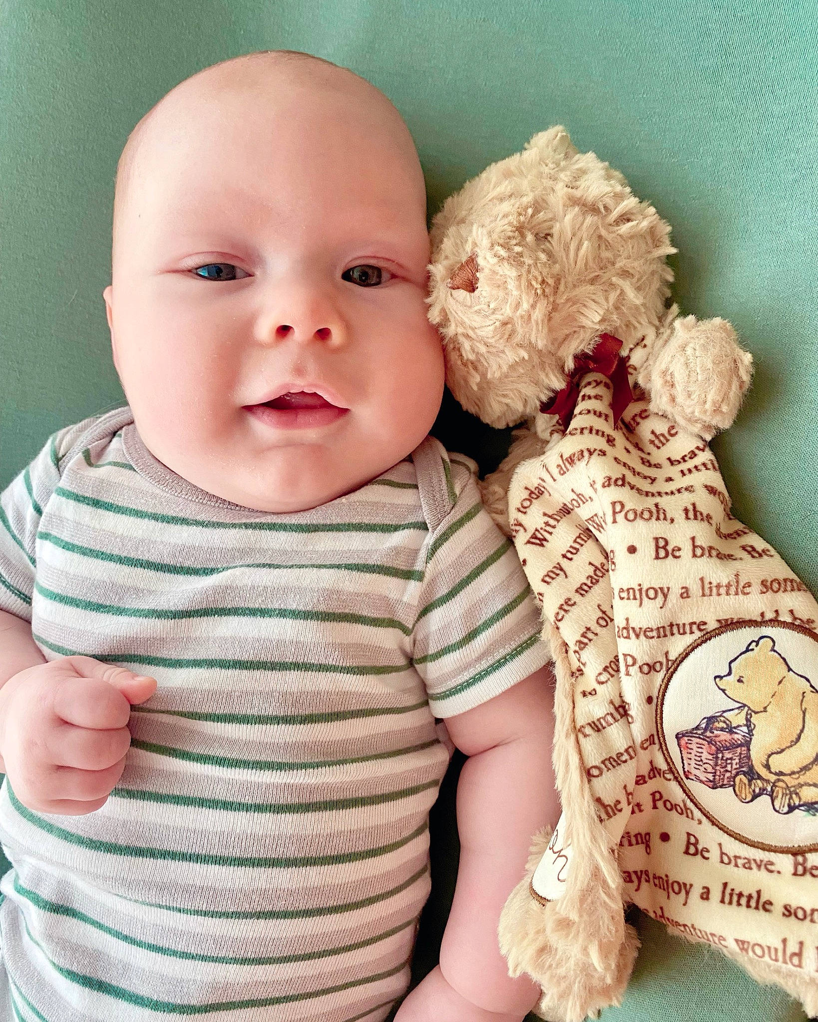 Ben is registered to the contest to win money with this photo: arm, baby, baby_toddler_clothing, cheek, child, comfort, eye, facial_expression, finger, gesture, hand, happy, iris, lip, neck, nose, person, pink, skin, sleeve