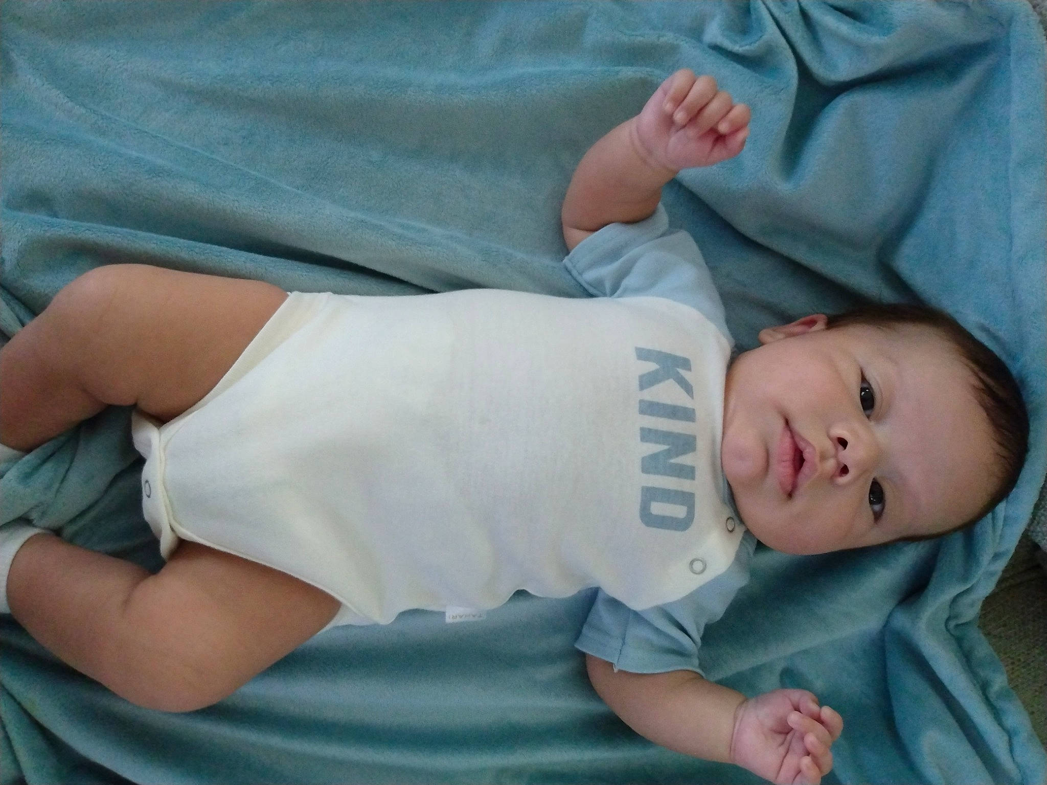 Melki is registered to the contest to win money with this photo: baby, baby_products, baby_toddler_clothing, cheek, child, comfort, elbow, gesture, grass, human_leg, joint, knee, linens, person, sitting, skin, sleeve, t_shirt, thigh, toddler