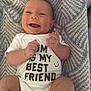 Thaddeus joined the competition — help win amazing prizes! baby, smiling, onesie, text_on_clothing, blanket, infant, happy, face, hands, legs, cute, child, lying_down, indoors, person, closeup, skin, expression, newborn, toddler