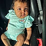 Delilah is registered to the contest to win money with this photo: baby, infant, child, car_seat, seatbelt, clothing, mint_green, embroidered, flowers, skin, legs, arms, face, eyes, curious, sunlight, shadow, texture, comfort, indoor