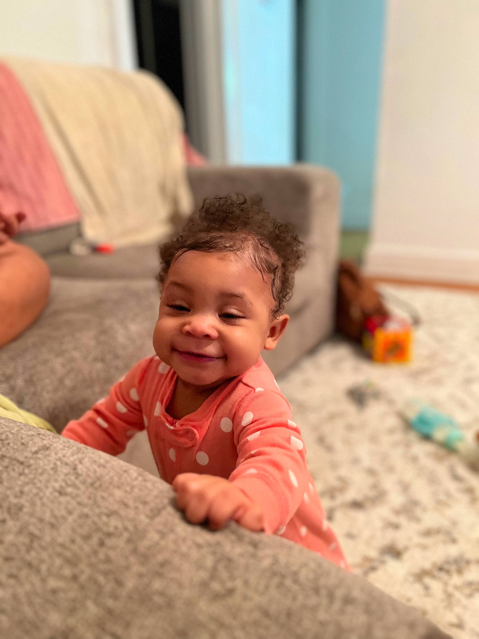 Aliona is registered to the contest to win money with this photo: baby, baby_toddler_clothing, cheek, child, comfort, couch, crawling, floor, flooring, fun, happy, hardwood, joy, leisure, linens, person, play, room, sitting, smile