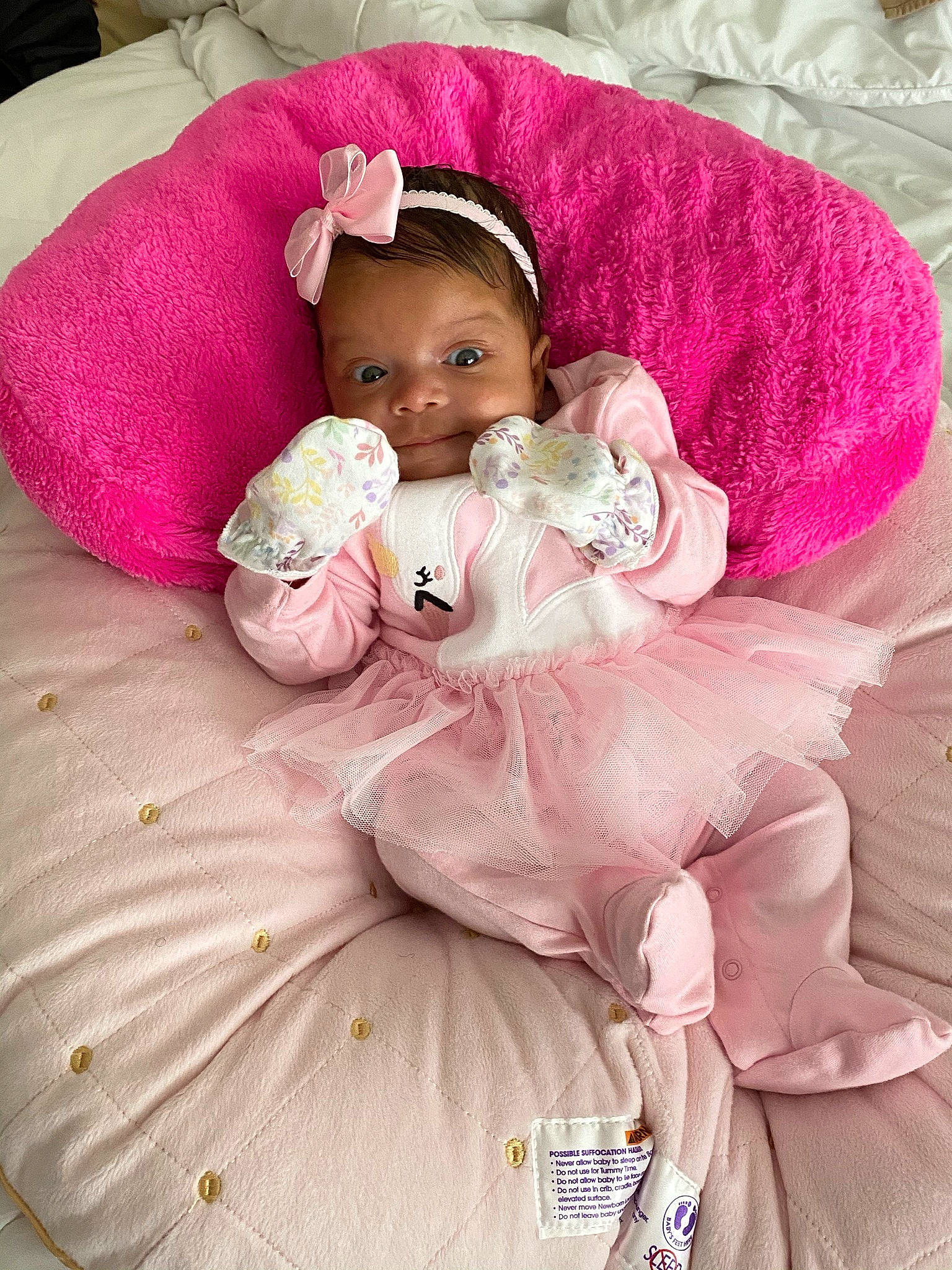 Alani joined the competition — help win amazing prizes! baby, baby_products, baby_toddler_clothing, bed_sheet, bedding, blanket, bonnet, costume_accessory, embellishment, hair_accessory, headband, headgear, linens, magenta, nose, peach, person, pink, textile