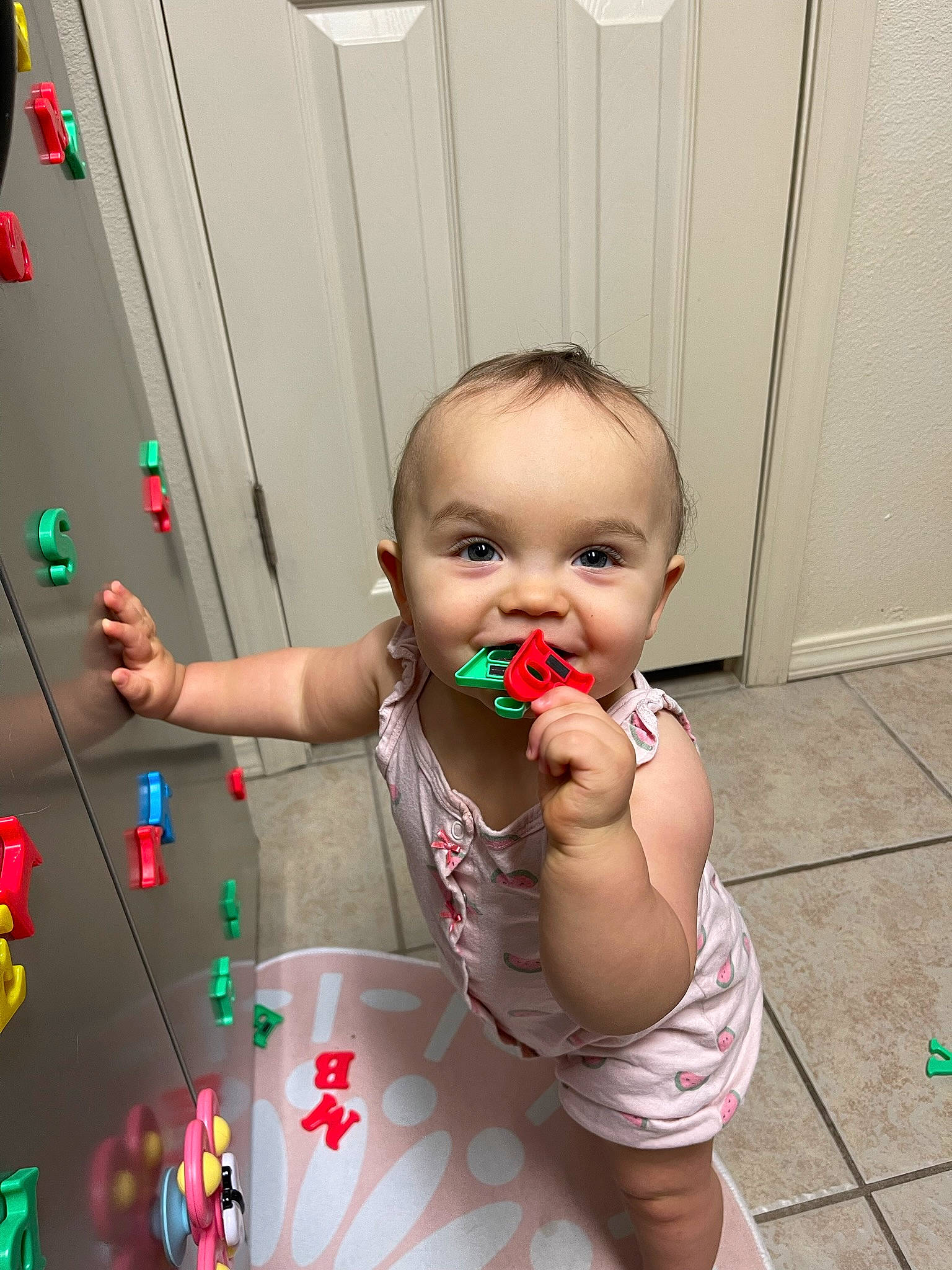 Lucy is registered to the contest to win money with this photo: arm, baby, child, event, finger, flooring, foot, fun, happy, holiday, human_body, joy, nail, ornament, person, play, room, sitting, toddler, toy