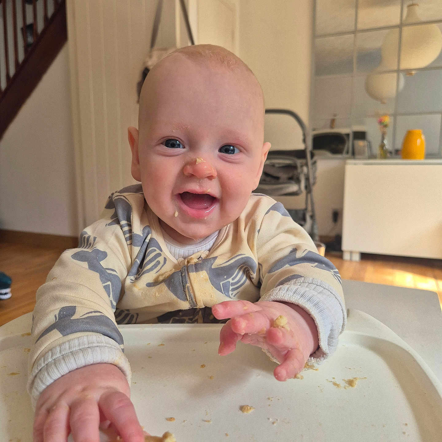 Noah is registered to the contest to win money with this photo: accessories, architecture, baby, bag, bodypart, bread, cracker, cup, cutlery, face, finger, food, hand, handbag, happy, head, person, photography, portrait, spoon