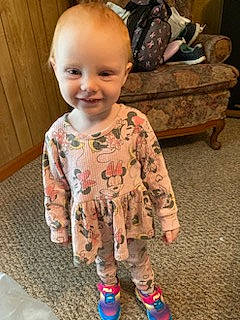 Neaveh is registered to the contest to win money with this photo: baby, baby_toddler_clothing, cheek, child, comfort, face, flooring, fun, hairstyle, happy, head, joy, mammal, nose, person, product, shoe, skin, sleeve, smile