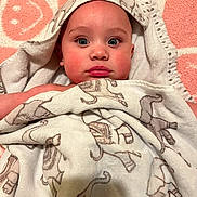 Levi joined the competition — help win amazing prizes! baby, blanket, child, cozy, cute, elephant_pattern, expression, eyes, face, head, indoor, infant, newborn, pink, portrait, skin, smile, soft, towel, wrapped