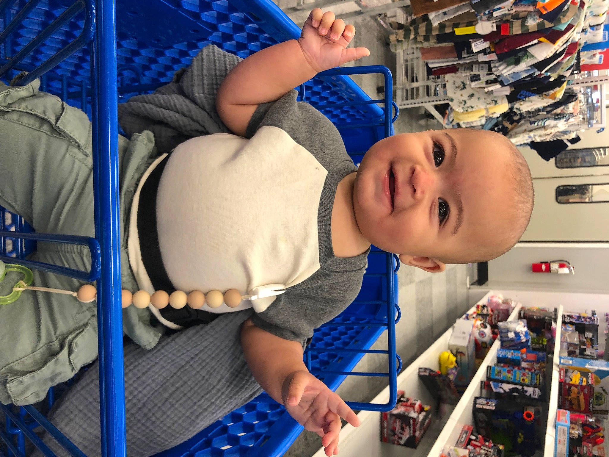Evren joined the competition — help win amazing prizes! baby, baby_products, baby_toddler_clothing, blue, child, comfort, customer, electric_blue, fun, hat, joy, machine, person, product, retail, room, shelf, shelving, smile, t_shirt