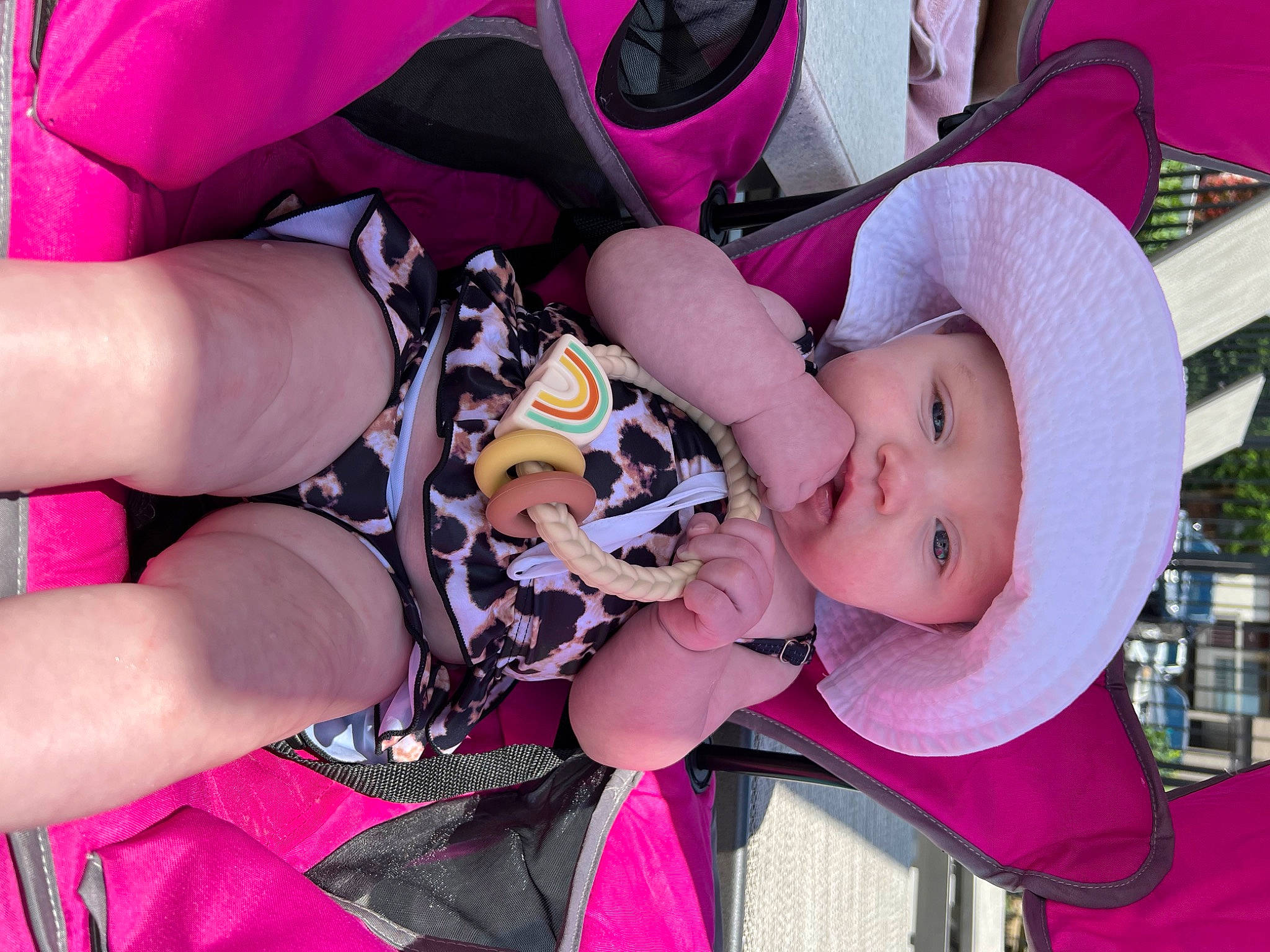 Maylee is registered to the contest to win money with this photo: baby, baby_products, baby_toddler_clothing, beauty, child, comfort, fashion_accessory, hat, headwear, human_leg, magenta, nail, pattern, person, pink, purple, sun_hat, textile, thigh, toddler