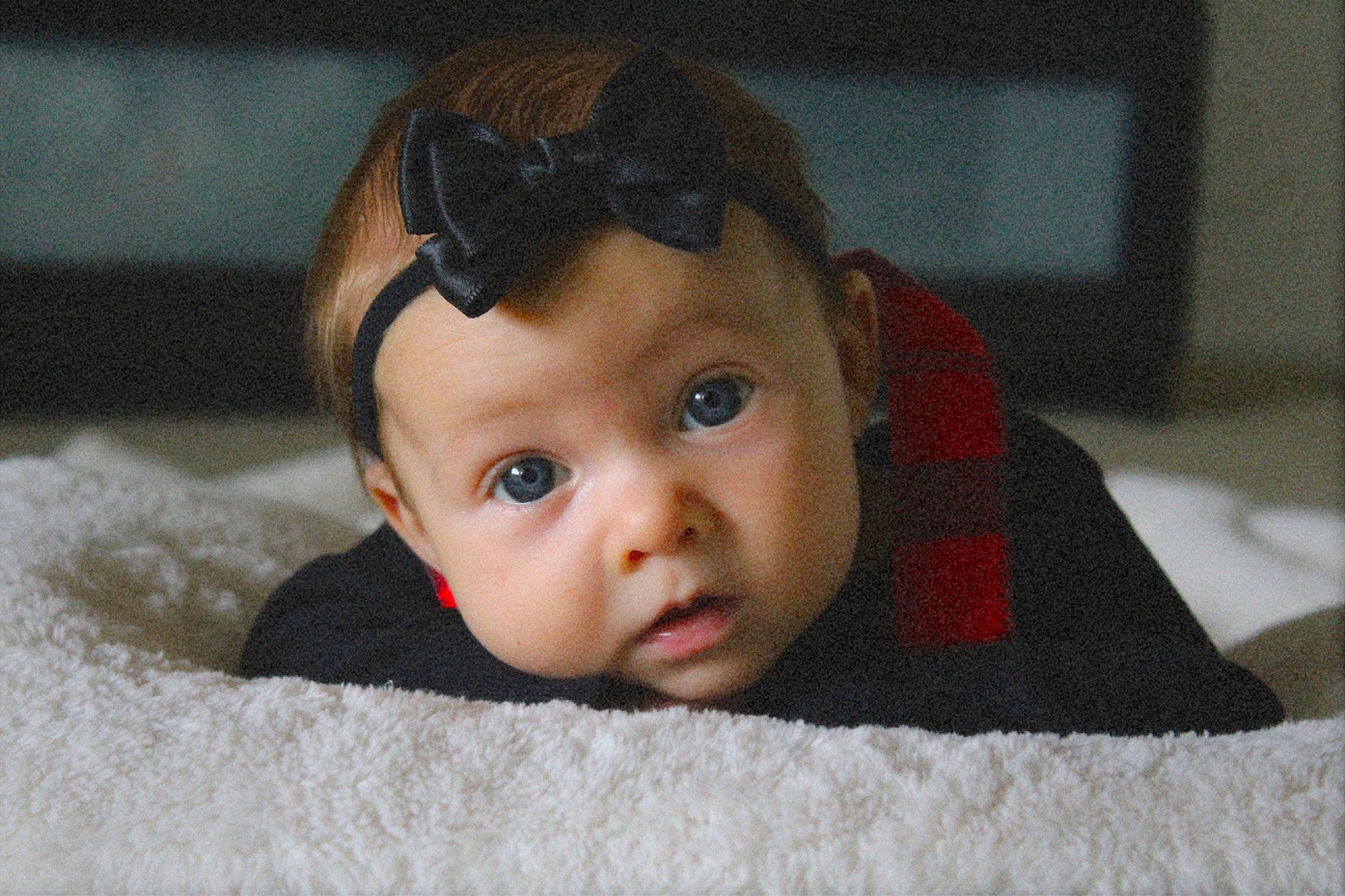 Oaklee is registered to the contest to win money with this photo: baby, carmine, cheek, chin, comfort, eye, eyebrow, eyelash, flooring, fun, fur, happy, iris, linens, lip, nose, person, room, smile, toddler