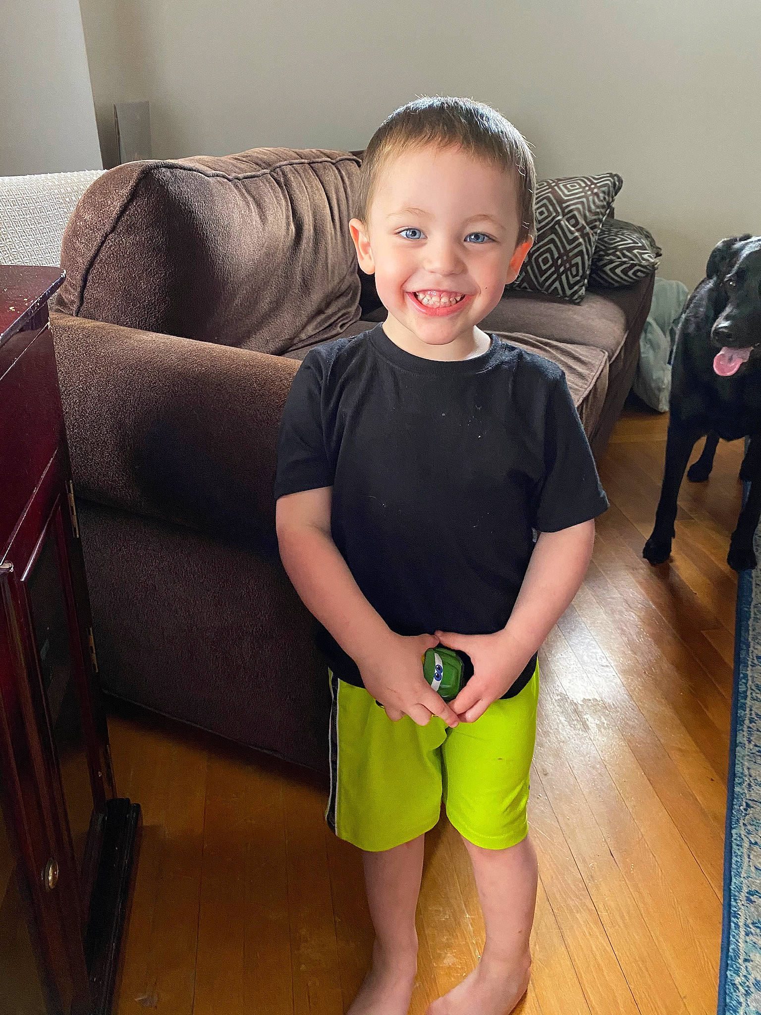 Josiah joined the competition — help win amazing prizes! active_shorts, baby_toddler_clothing, bag, bermuda_shorts, calf, child, couch, ear, floor, flooring, foot, human_leg, joint, joy, knee, laugh, living_room, person, shorts, studio_couch