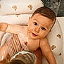 Mattias is registered to the contest to win money with this photo: baby, bath, bathtub, water, child, cute, face, skin, wet, tub, shower, infant, smile, playing, happy, sitting, indoors, head, portrait, person
