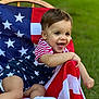 american_flag, baby, celebration, chair, child, clothing, cute, grass, happy, lawn, outdoor, person, playful, portrait, smiling, sock, stars, stripes, summer, toddler