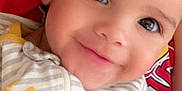 Rustyn joined the competition — help win amazing prizes! apparel, baby, babywear, child, closeup, cute, eyes, face, happy, head, human, infant, onesie, person, portrait, skin, smiling, striped_clothing, textile, toddler