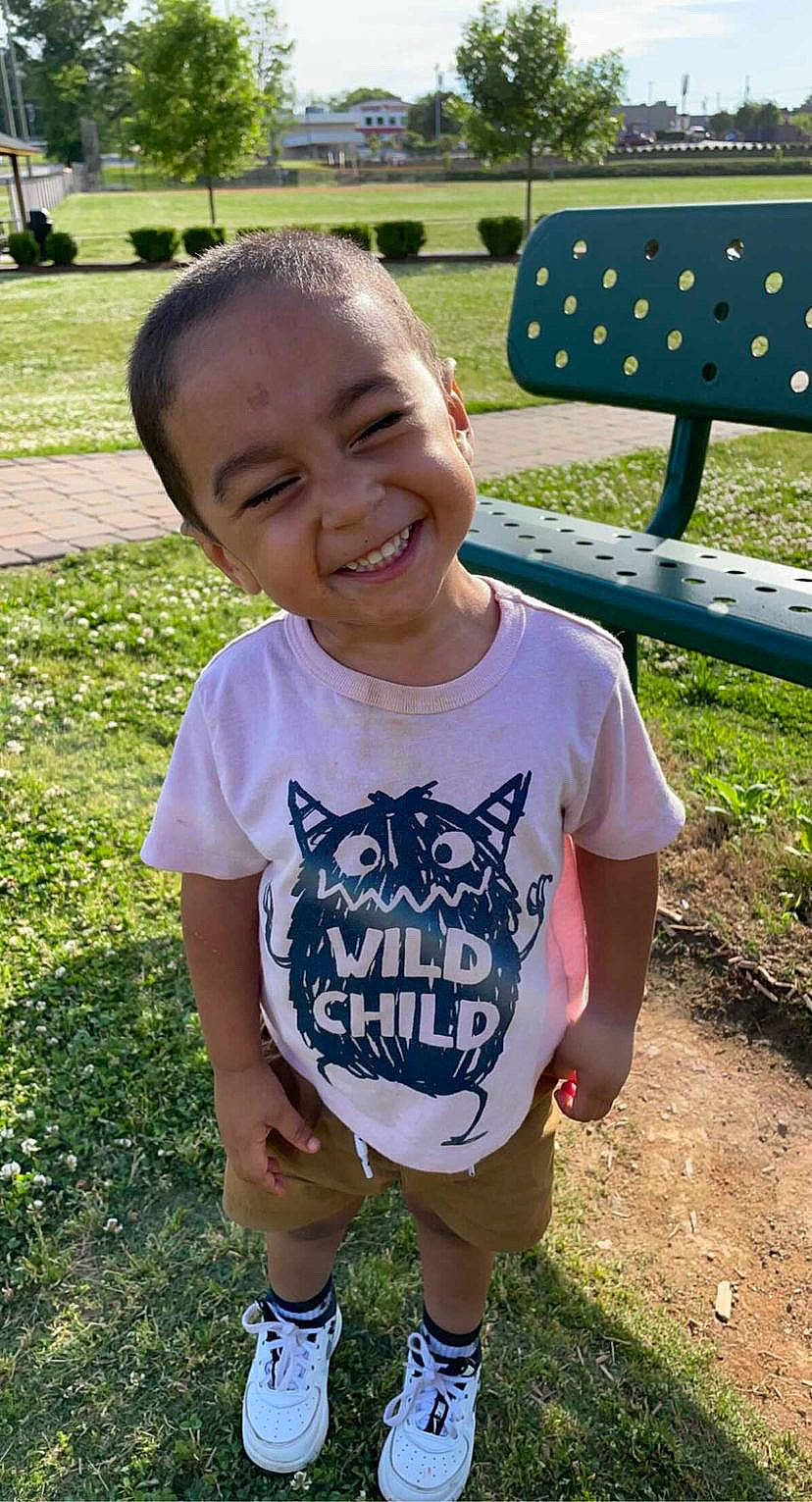 Derrick joined the competition — help win amazing prizes! baby_toddler_clothing, eye, face, fun, grass, happy, joy, leaf, leisure, light, mammal, mouth, outdoor_bench, person, plant, sleeve, smile, summer, t_shirt, toddler