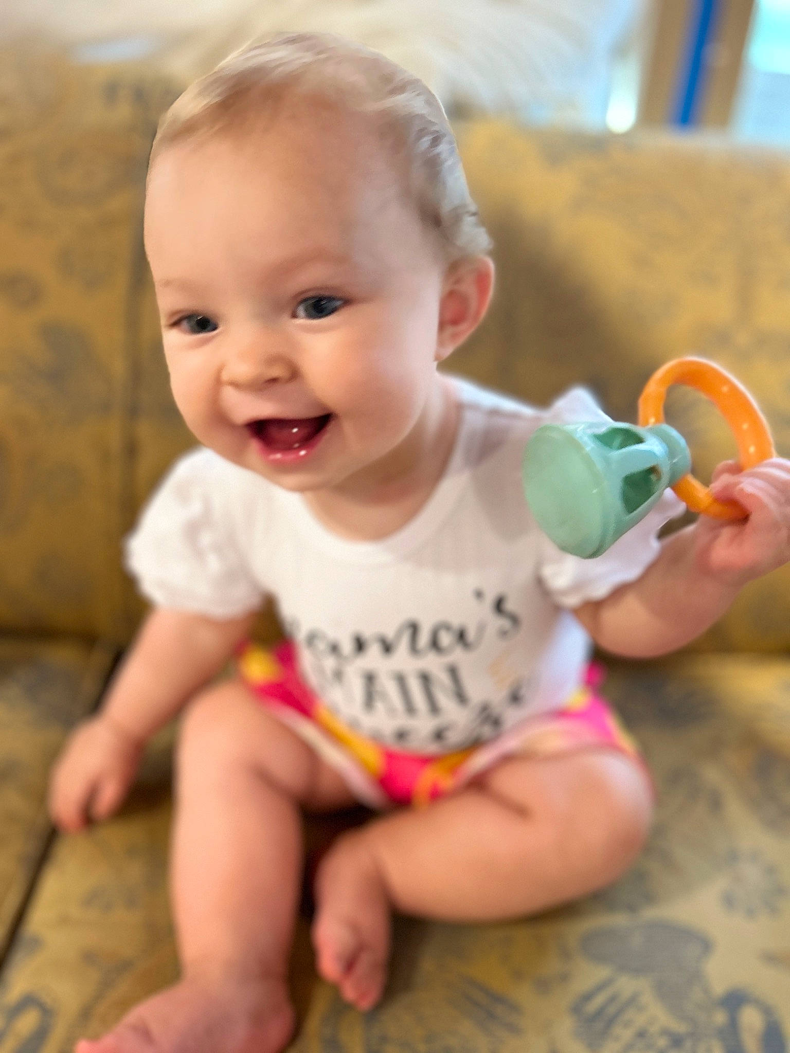 Madison joined the competition — help win amazing prizes! baby, baby_toddler_clothing, cheek, child, finger, flooring, foot, fun, grass, happy, human_leg, iris, pattern, person, sitting, skin, sleeve, smile, t_shirt, thumb