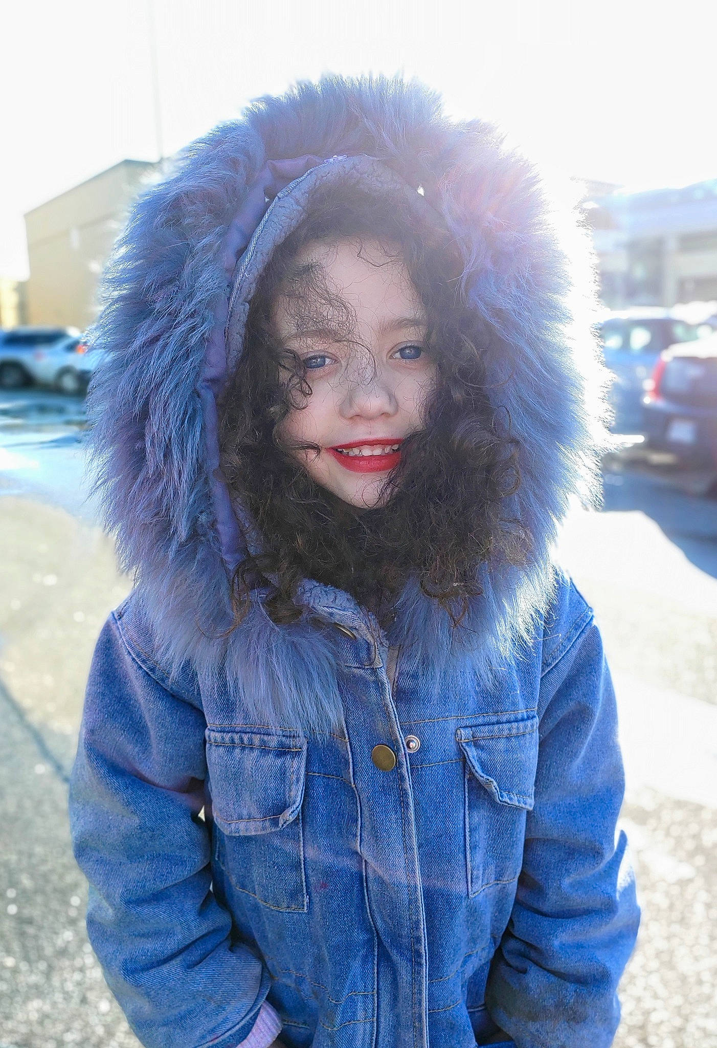 Nora is registered to the contest to win money with this photo: black_hair, car, cool, denim, electric_blue, eye, freezing, fun, fur_clothing, glove, happy, iris, jacket, outerwear, person, smile, street_fashion, textile, tree, wheel